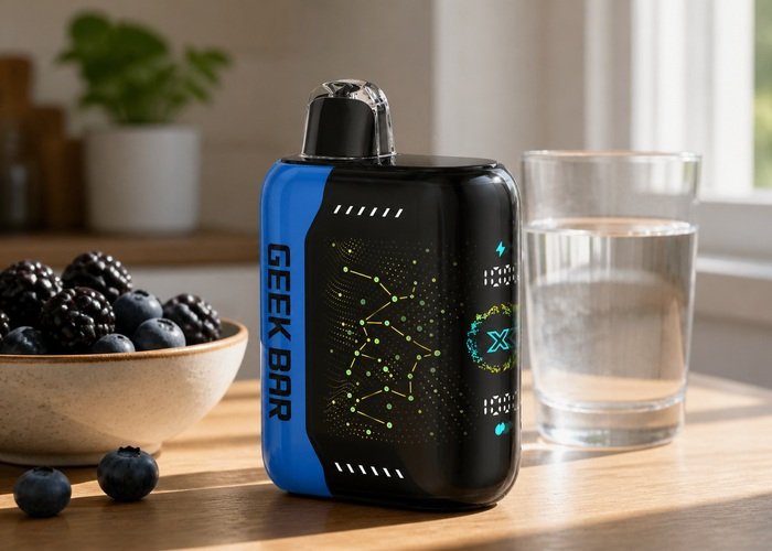 Geek Bar Pulse X Blackberry Blueberry beside blackberries, blueberries and water on an adult kitchen table