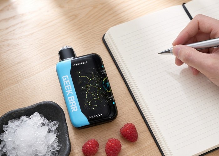 Adult noting a Geek Bar Pulse X Blue Razz Ice flavor impression beside berries