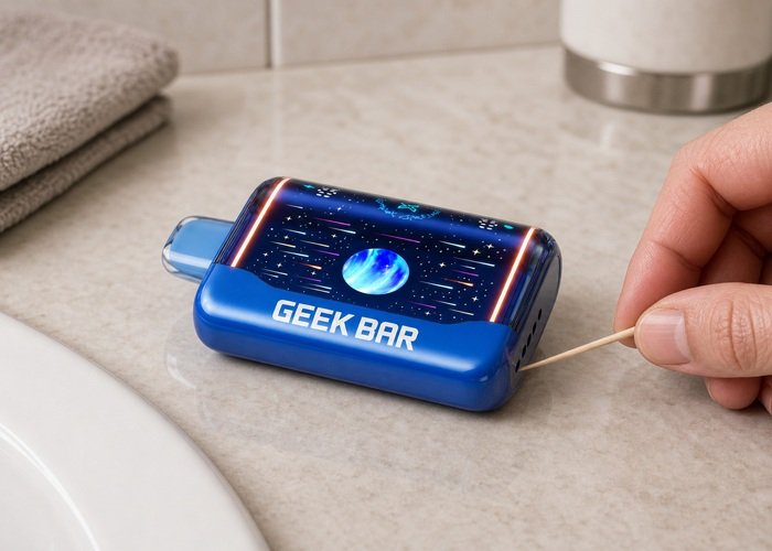 Blue Geek Bar Pulse X2 resting on a dry counter during an exterior airflow-opening check