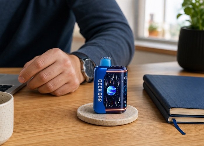 Adult noticing an illuminated blue Geek Bar Pulse X2 on a desk