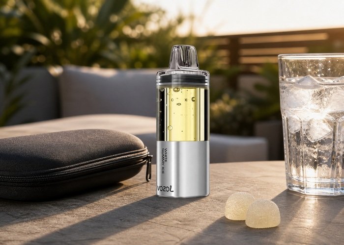 VOZOL Mega 50K White Gummy Ice stored upright beside a plain pouch and ice water