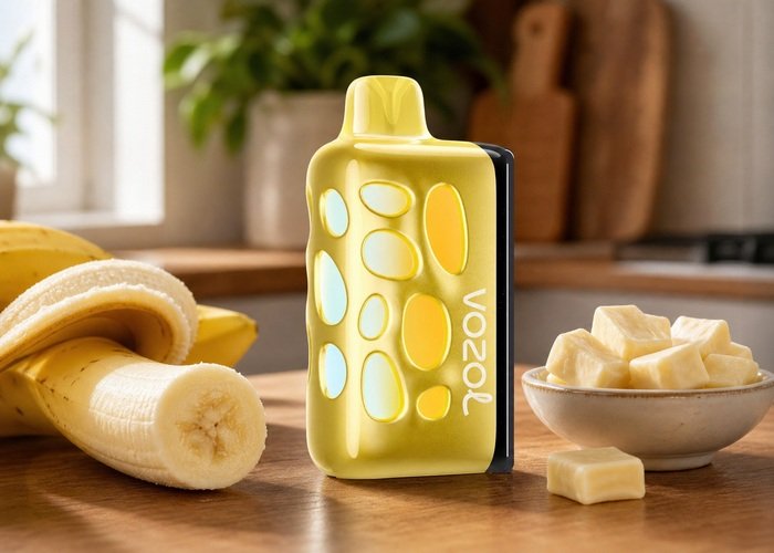 Gold VOZOL Rave 50K Banana Taffy beside banana and candy on an adult kitchen table