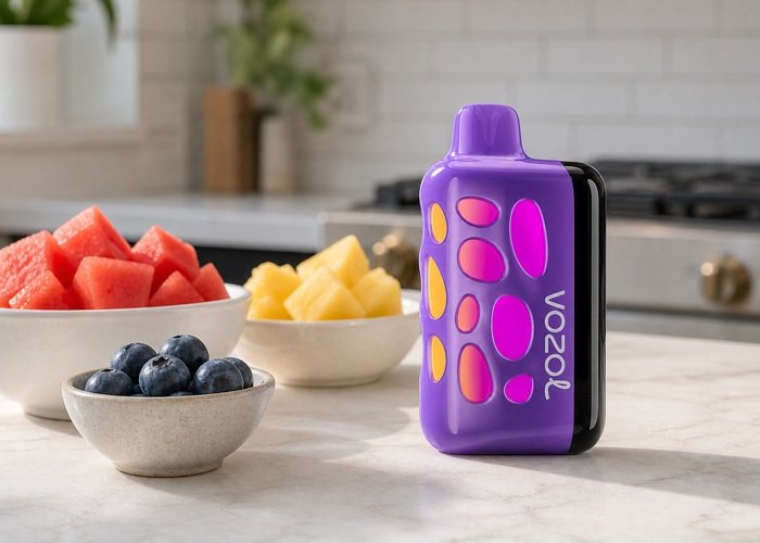 Purple VOZOL Rave 50K beside fruit bowls on an adult kitchen counter