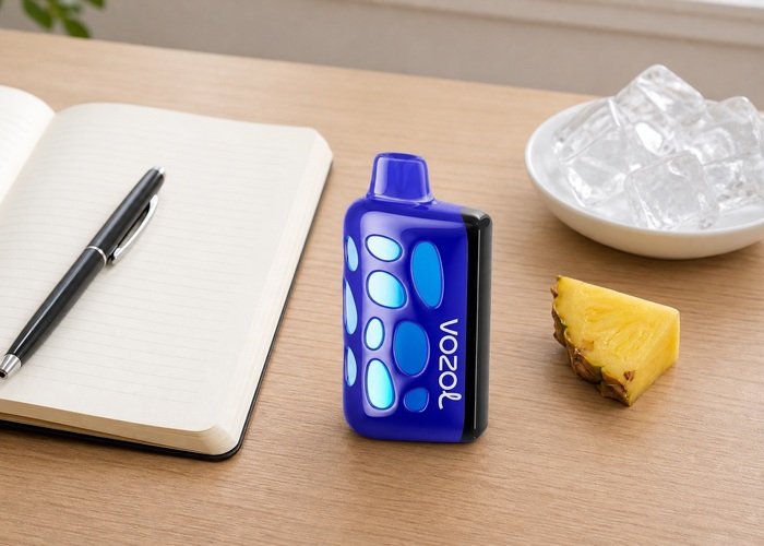 VOZOL Rave 50K Hawaiian Pineapple Paradise beside a blank tasting notebook and pineapple