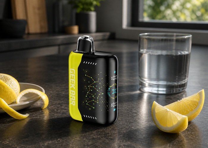 Yellow Geek Bar Pulse X Lemon Heads beside lemon peel and water on an adult kitchen table