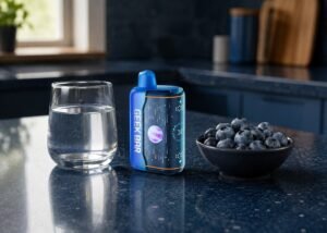 Geek Bar Pulse X22 Blueberry Jam beside blueberries and a small jar of jam on an adult kitchen counter